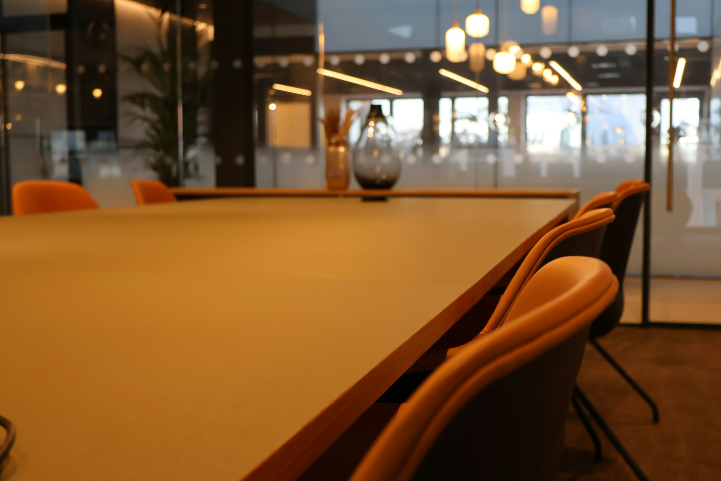 Conference room with warm lighting and upholstered chairs